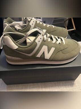 New. Never worn outside.  New Balance sneakers. Green. Very comfortable.